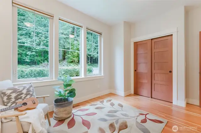 2nd bedroom on the main floor. Currently used as a music room. Could also make a great office