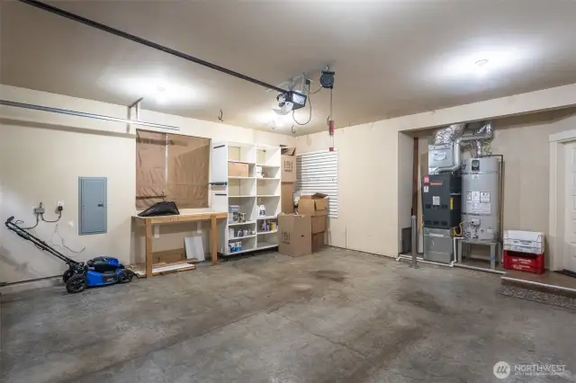 Two-car garage with a half step into the home. Great, low barrier entry into the home. New water heater in 2022