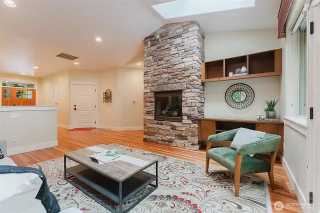 Open living room with light let in by large skylights.