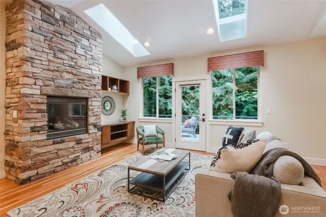 Stone fireplace anchors the room