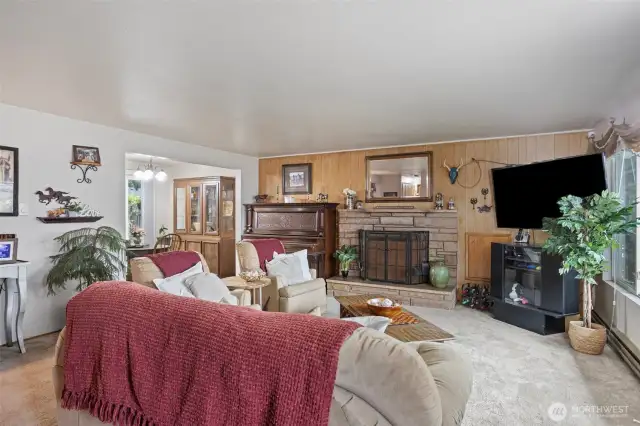 Inviting family room with  cozy wood burning fireplace