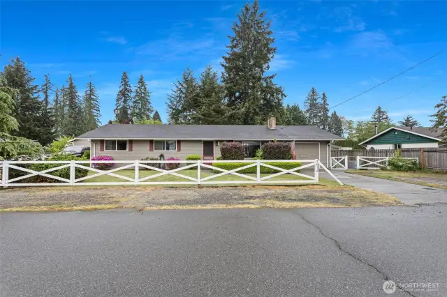 1300sqft rambler with gated RV parking on the left and a plenty of parking on the right!