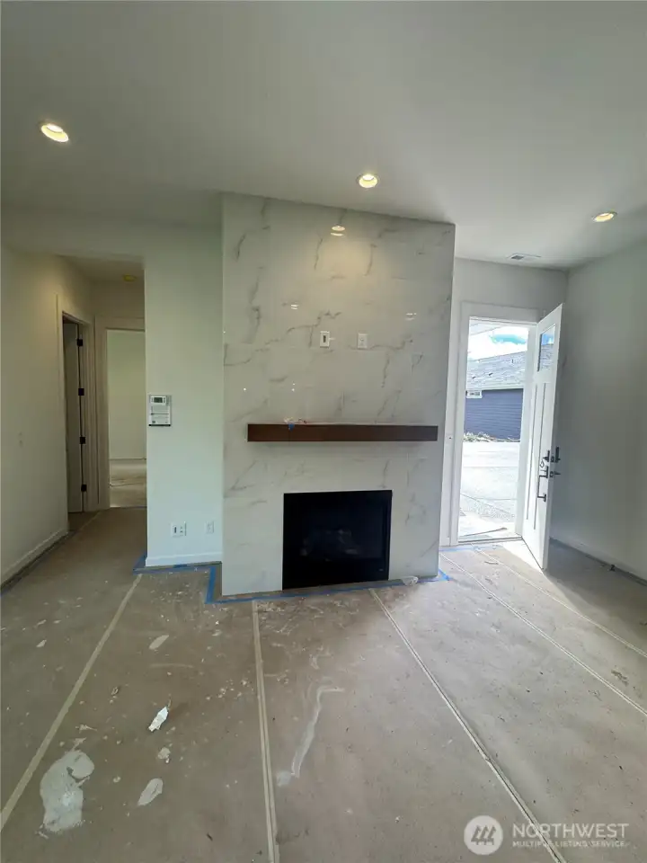 Beautiful floor to ceiling fireplace surround with mantel