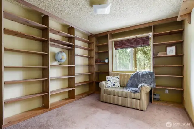 2nd Upstairs bedroom with wall to wall shelving could also be used as an office/library.