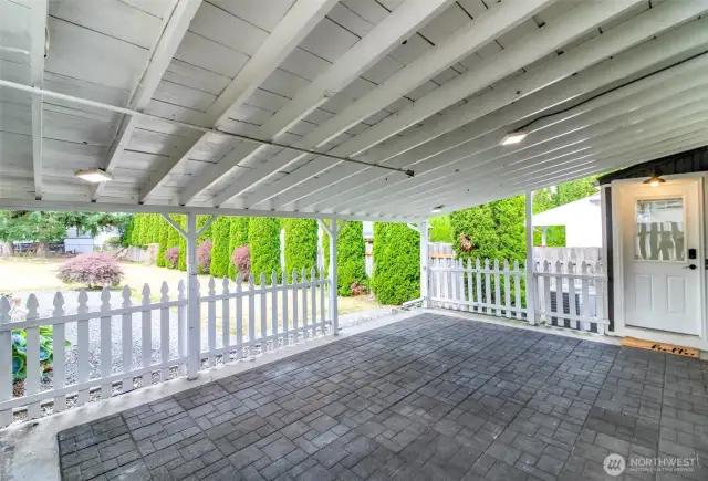 Covered patio leads to private backyard and fire pit! Tons of space for your garden too!