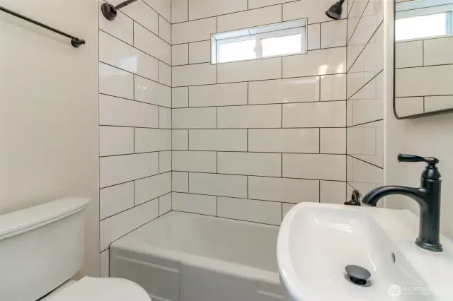 Modern main bathroom is light and bright, you're going to love it!