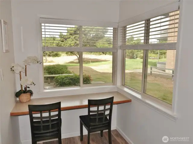 Breakfast Area w/ lots of natural light looking out to the hotel's backyard.