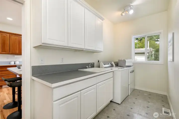 Laundry room is conveniently located off the extra large two car garage.