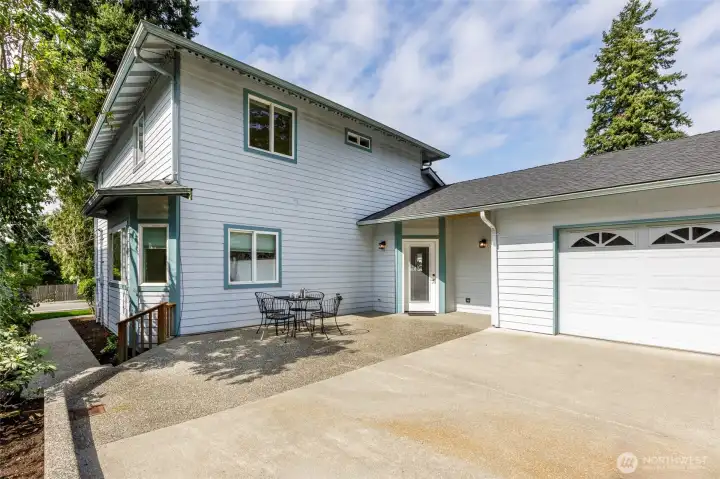 Large driveway and patio off alley.