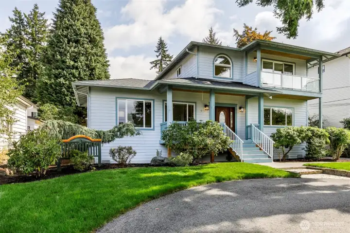 This Broadview home features a circular drive and garage off alley.