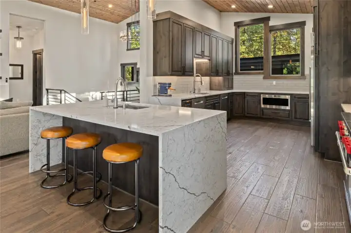 Chef’s kitchen with expansive island and custom cabinetry.