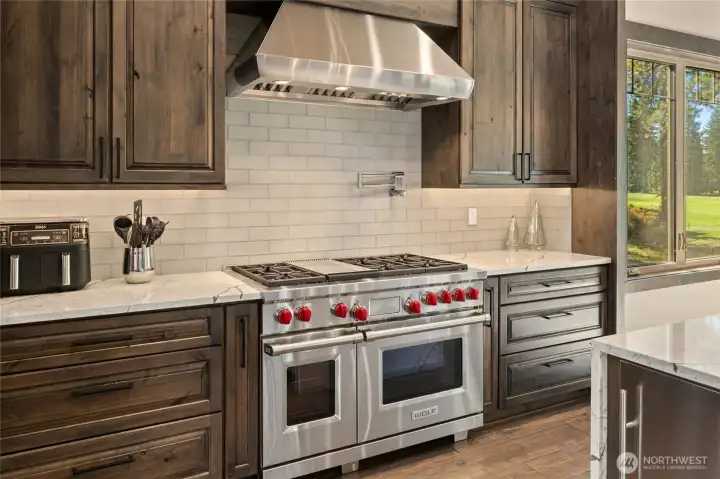 Stainless oven with gas cooktop for precision cooking.