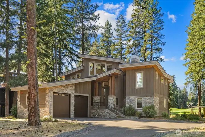 Contemporary architecture with timeless appeal. The striking stone-and-concrete entry welcomes you home.