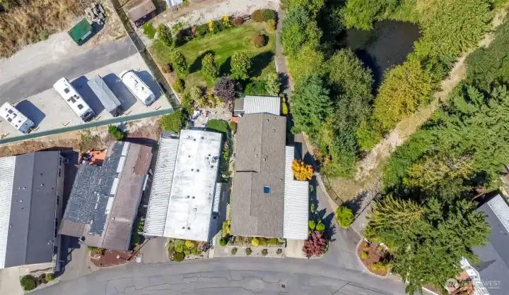 Composition Roof, covered back porch & extra community maintained yard behind unit #11