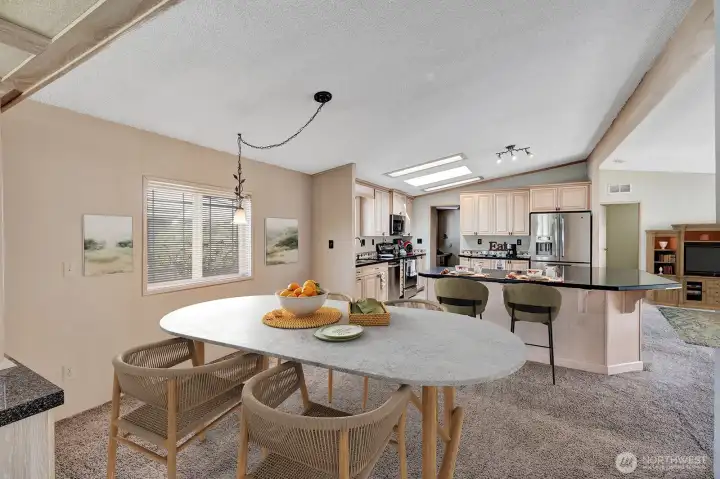 Formal dining area off the "modern-updated kitchen. Built in border hutches for storage of all dinnerware etc.  Virtually staged.