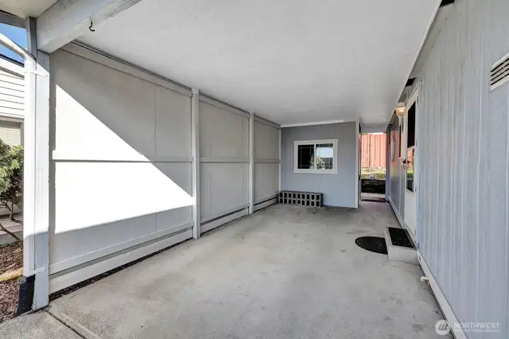 Enclosed, covered carport area. Access door into the utility room so no weather issues when unloading groceries etc.