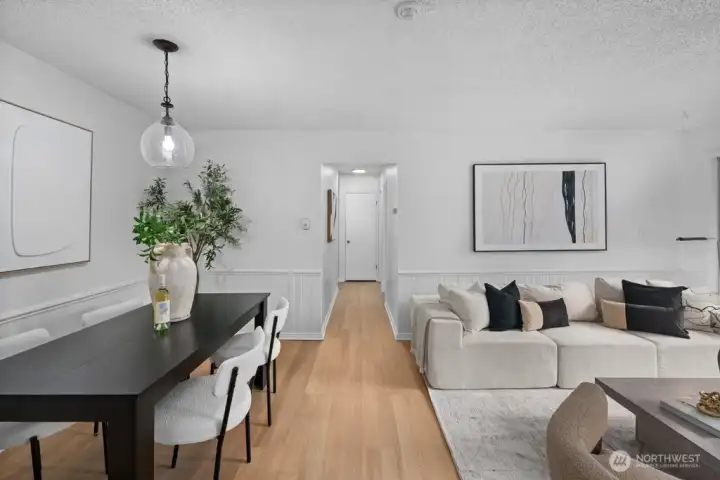 The spacious dining area easily accommodates a table of any size, ideal for everyday meals and entertaining alike.