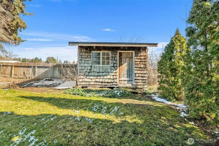 Garden shed, play house.  Backyard fence.