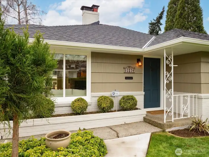 Nice covered porch and landscaping brings a new welcoming feel to 12239.