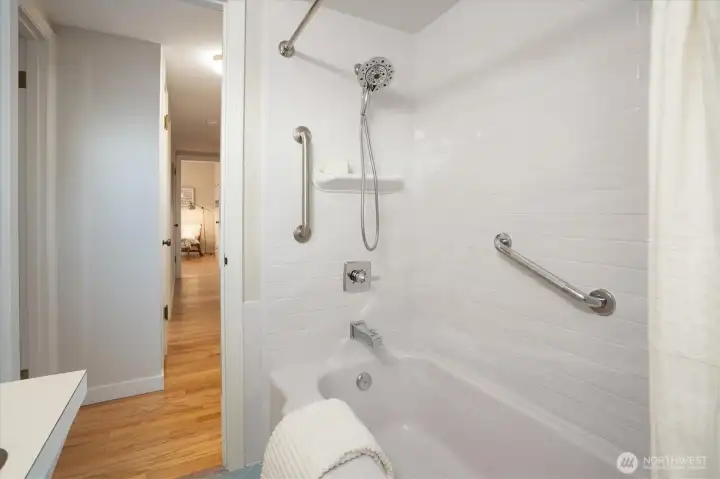 Bathroom is just off the hallway from the three bedrooms.