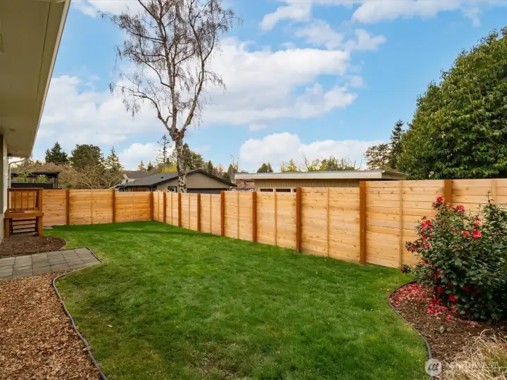 Another angle of the fully-fenced backyard.