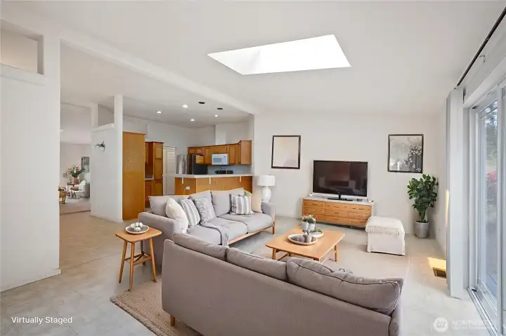 View from family room to kitchen (virtually staged)