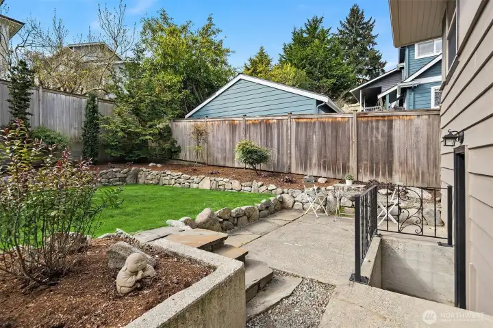 The back patio (the steps on the right side of the photo lead down to the external door in the downstairs bedroom).