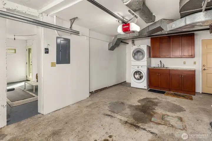 The attached garage, with the bonus room visible to the left. The entrance to the garage is at the bottom of the stairs, across the landing from the access door to the lower bedroom.