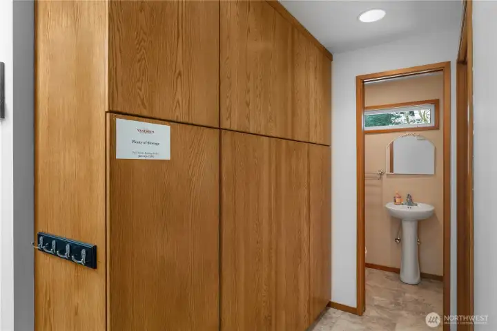 Added functionality with extensive storage cabinetry and nearby guest powder room.