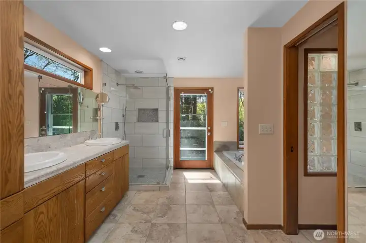 Spa-inspired primary bath offers generous space, quality finishes, and a bright, open layout.