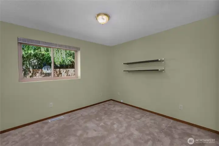 BR 2 - Bright bedroom with a peaceful outlook and room for guests, office, or hobbies.