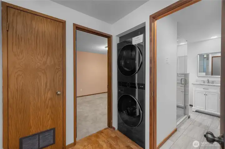 Newer Stacked Washer and Dryer Included - Functional hall layout includes stacked laundry and easy access to the updated bath.