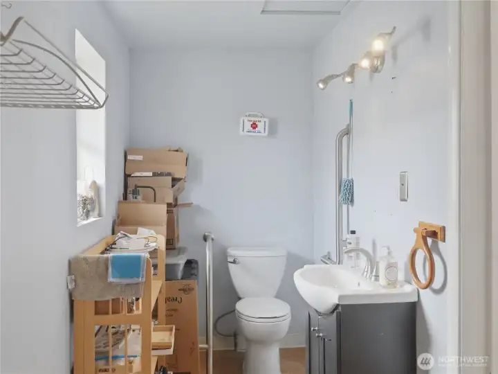 Bathroom Located in Store Front/Great Room Currently being used for storage.