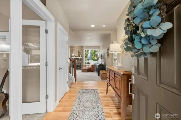 Immediately greeted w/ rich hardwood flooring & 9 foot ceilings.