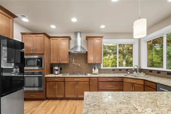 Chef’s kitchen anchors the home...