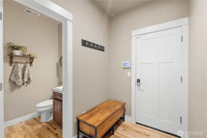 Main floor guest bath off garage entry.