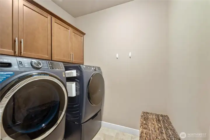 Oversized utility room off garage /built in cabinets.