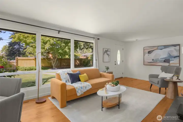 spacious living room (drywall just replaced in ceilings), hardwood floors