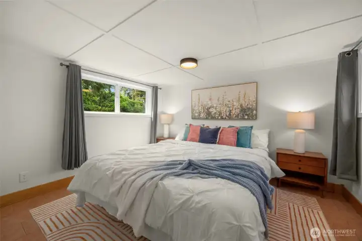 primary bedroom (former garage) with room for a king-sized bed, plus walk-in closet