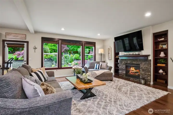 Great room with gas fireplace and huge views of the backyard. Great room with gas fireplace and huge views of the backyard.