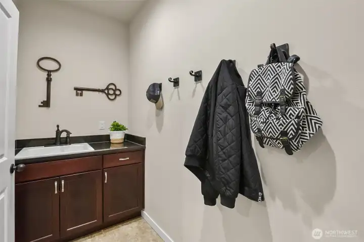 Mud room is just off the kitchen on route to the garage. Mud room is just off the kitchen on route to the garage.