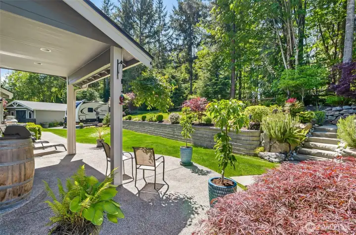 Back patio looking out to yard, RV parking and detached shop. Back patio looking out to yard, RV parking and detached shop.
