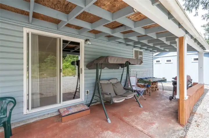 Covered patio conveniently located off the dining area, creating the perfect outdoor retreat for relaxing, entertaining, and enjoying BBQs with guests. Covered patio conveniently located off the dining area, creating the perfect outdoor retreat for relaxing, entertaining, and enjoying BBQs with guests.