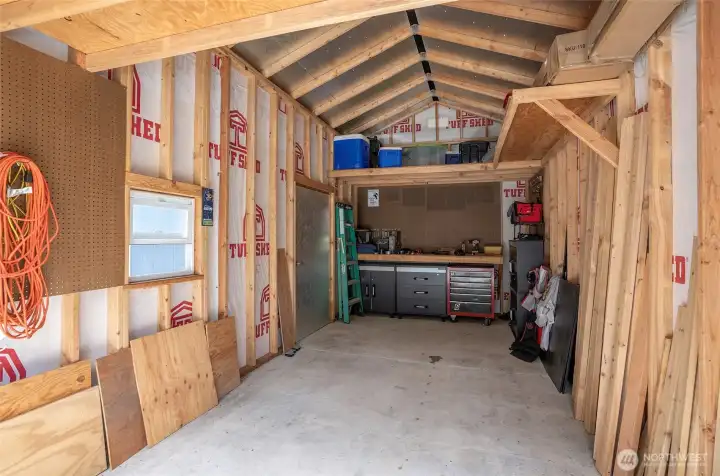 Detached garage featuring a dedicated shop/work area in the back, providing the perfect space for projects, hobbies, storage, or a home workshop. Detached garage featuring a dedicated shop/work area in the back, providing the perfect space for projects, hobbies, storage, or a home workshop.