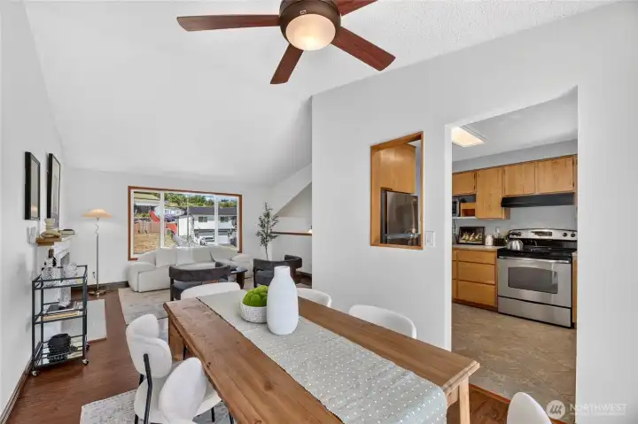 View from dining room showing the kitchen and living area.   This is a great floor plan.