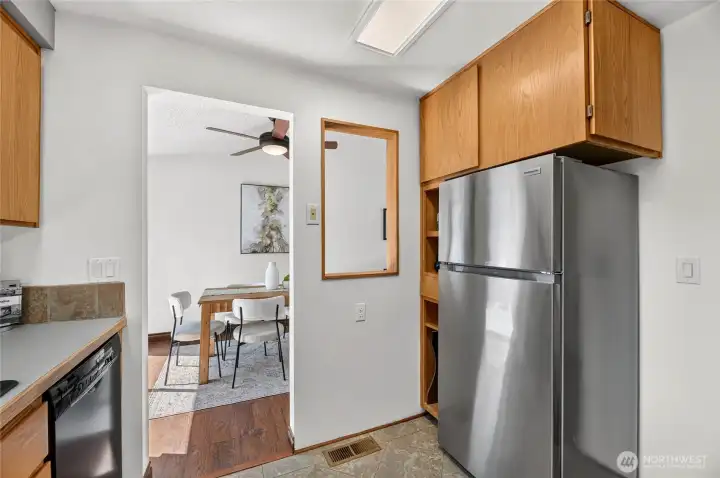 The kitchen has a cut out into the dining area, which provides a more light and open kitchen.