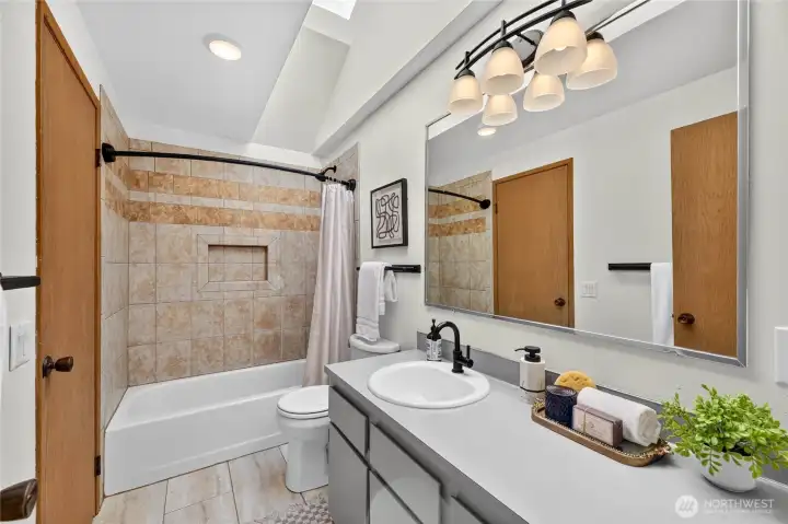Main floor bathroom is nicely updated with warm, neutral colors.