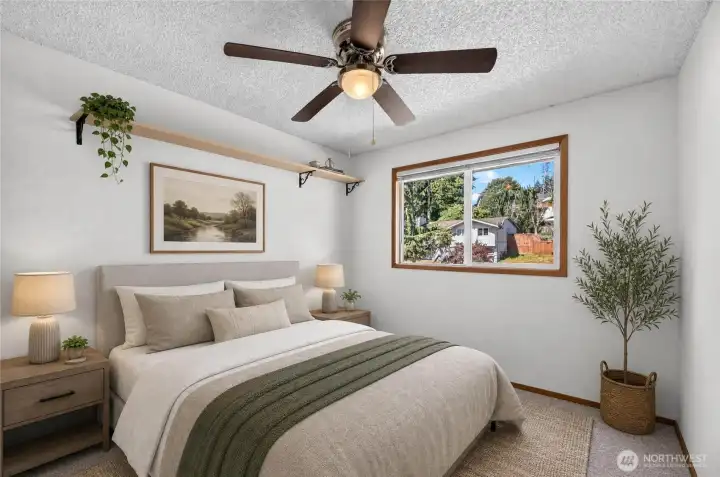 Bedroom #3 is on the main level and also overlooks the front of the home.  A new neutral carpet makes it a comfortable room.          *This bedroom photo is a virtually staged bedroom*.
