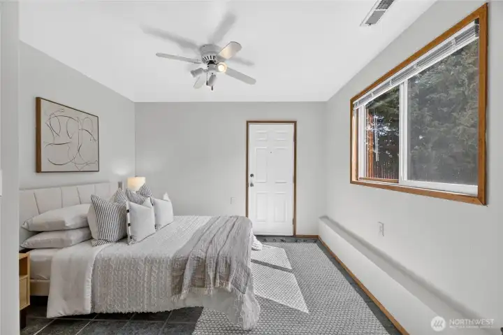 Bedroom # 4 is on the lower level and is a perfect bedroom for a teen who may desire more privacy, or a good guest bedroom.  It could even be a good bedroom to rent out, as it has exterior access to the ground level and backyard of the home.