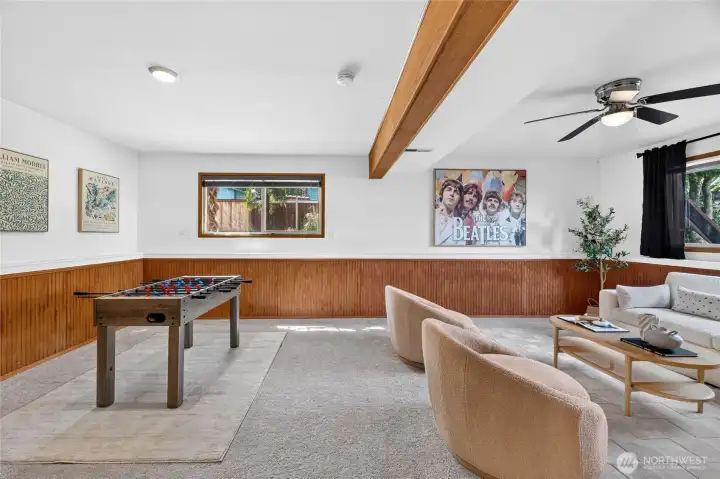 Recreation room on lower level is very spacious and light-filled and has a nice ceiling fan.